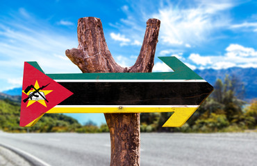 Mozambique Flag wooden sign with road background