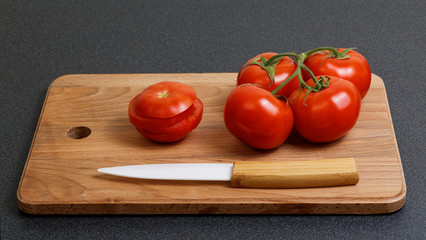 Fresh tomato and ceramic knife