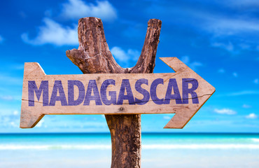 Madagascar wooden sign with beach background