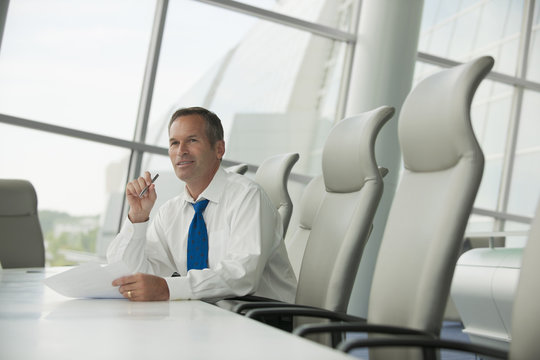 Caucasian businessman working in conference room