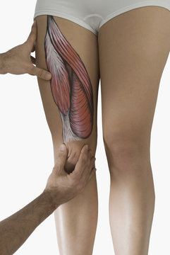 Chiropractor adjusting woman's leg