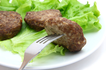 beef Patty with lettuce on white background