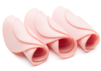 cooked boiled ham sausage or rolled bologna slices isolated on w © Natika