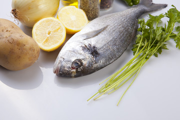 Raw sea bream fish with some ingredients