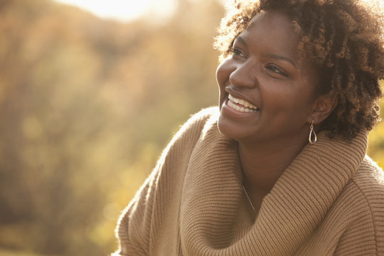 Smiling Black woman outdoors