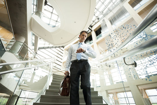 Caucasian businessman on office steps