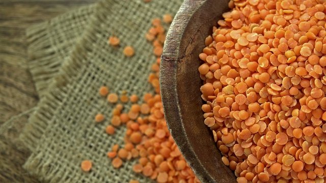 Heap of rotating red lentils (not loopable 4K footage)