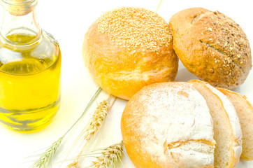 fresh bread and wheat on white