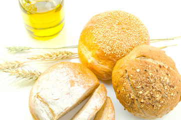 fresh bread and wheat on white