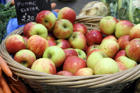 Basket filled with bright red and green apples., Provins, France