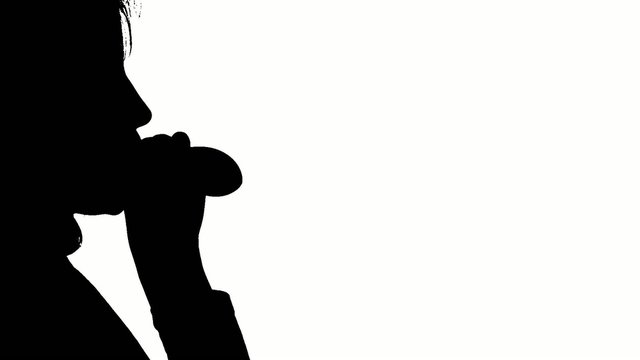Girl blowing balloon isolated on white background, silhouette