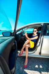 Woman making self portrait in the car