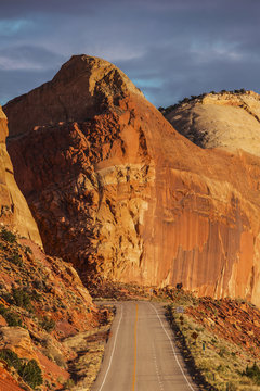 Rock formations over rural road, Wayne, Utah, United States