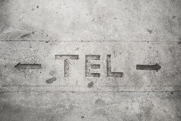 Telecommunication sign on cement floor