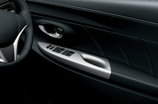 Car interior detail. Closeup of controls on the door