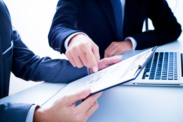 Business people discussing the charts and graphs showing the res