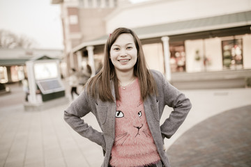 Young woman walking on a winter city.