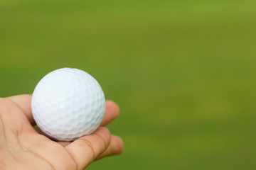 Golf ball in hand
