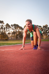 Obraz premium Female runner on an athletics track