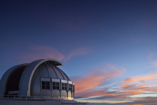 Observatory under colorful sunset sky, Mauna Kea, Hawaii, United States, 