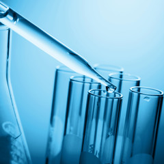 Dropping chemical liquid to test tube