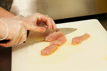 sliced chicken with a knife