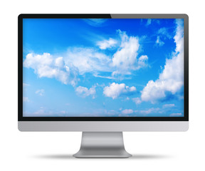 Computer display with blue sky and beautiful clouds on screen.