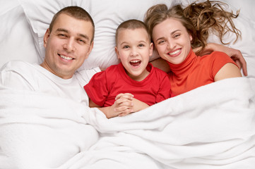Fototapeta premium Happy mother and the father with cute son