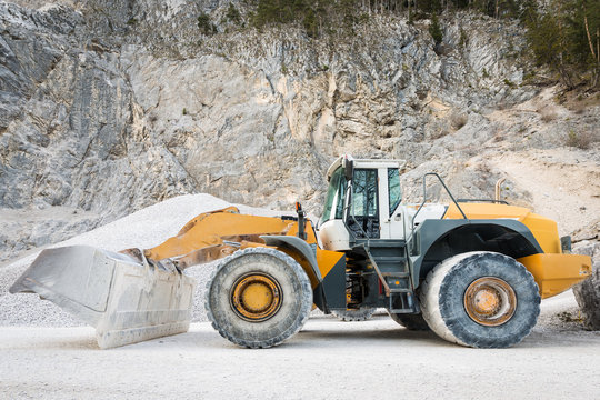 side view of large and heavy wheel mounted front loader at mine