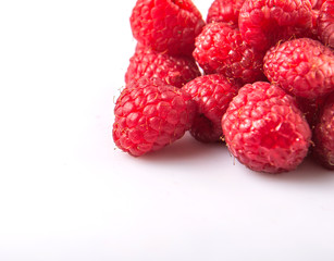 Raspberry fruit over white background