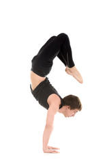 Yogi man in yoga Scorpion Pose Vrischikasana 2