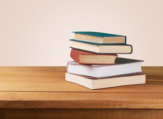 Retro. Vintage old books on wooden deck table over grunge