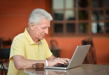  man sitting with laptop