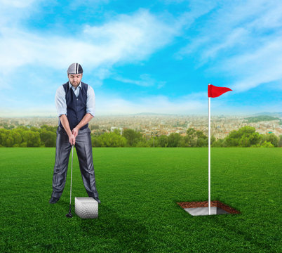 Businessman playing golf