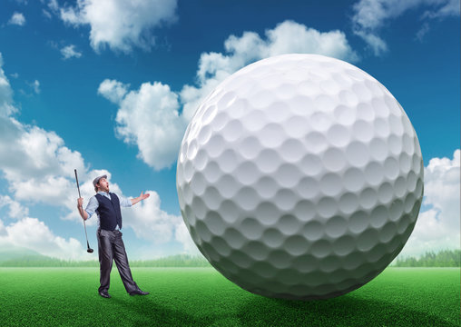 Businessman playing golf