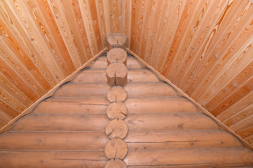 Timbered laying of the wooden house. Fragment of a corner and ce