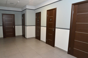 Interior of a corridor of office building with doors