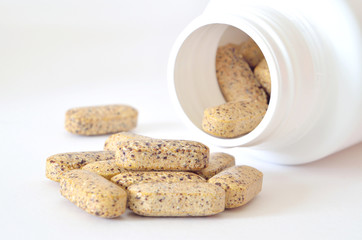 Bottle of multivitamin supplement pills