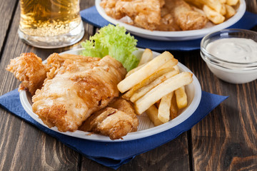 Fish and chips with tartar sauce on a plate