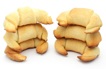 Stack of fresh croissants on white background