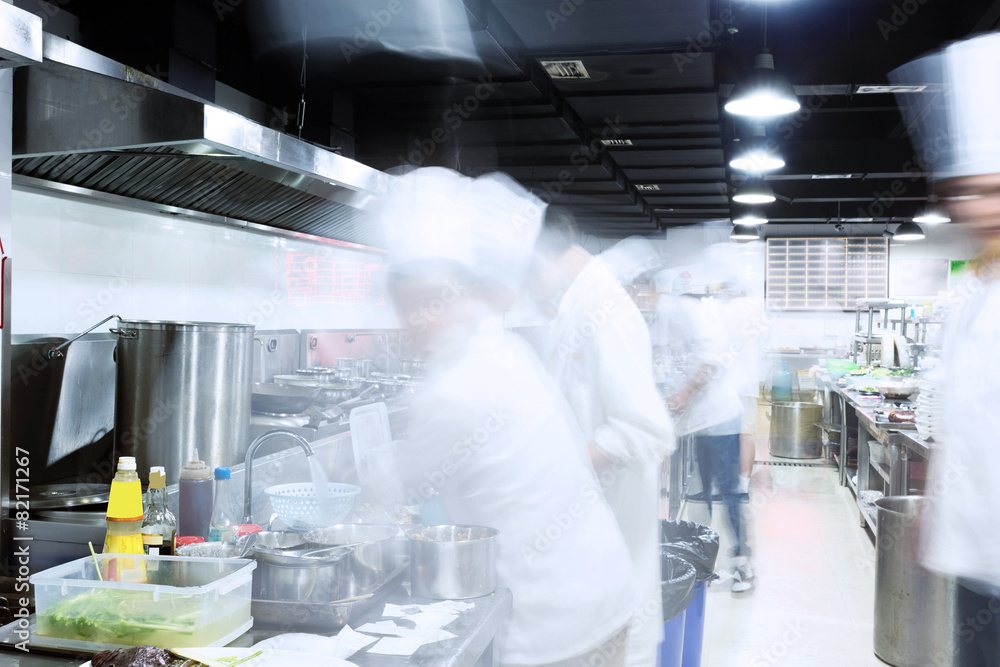 Wall mural modern kitchen and busy chefs