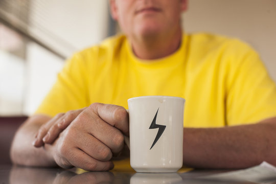 Close up of Caucasian man having cup of coffee