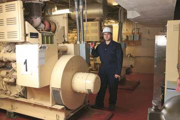 Generator  in a hospital with a repair men.