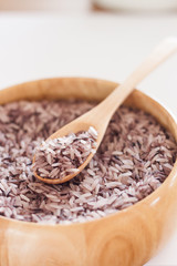 Berry rice in wooden bowl