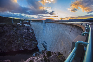Sun rising over dam, Daggett, Utah, United States