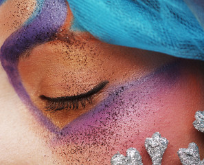 female eye with bright creative make-up