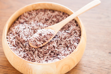 Berry rice in wooden bowl