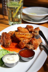 Bbq chicken wings with dips and salad