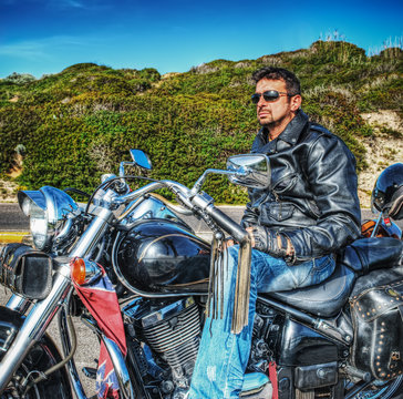 man on a classic motorcycle in hdr