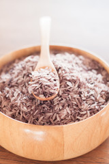 Berry rice in wooden bowl